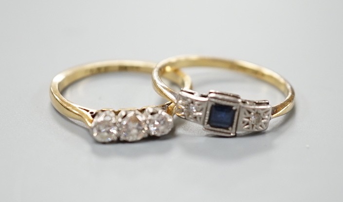 An 18ct and three stone diamond ring, size L/M and an 18ct, sapphire and diamond chip set three stone ring, gross weight 4 grams.